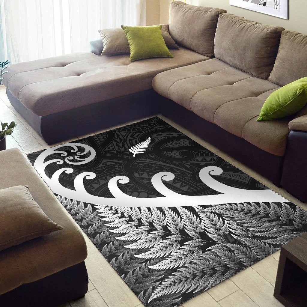 Black corner area rug with white koru swirl and fern feather leaf design