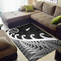 Black corner area rug with white koru swirl and fern feather leaf design