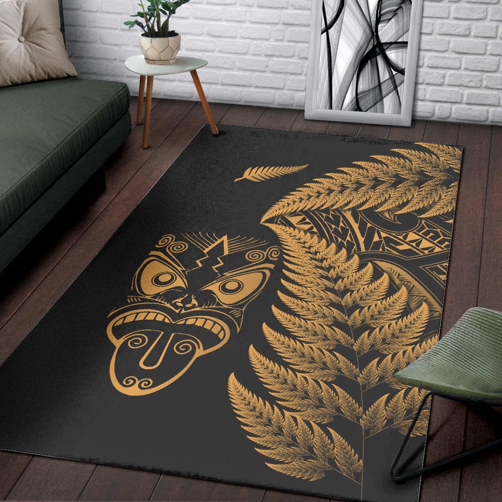 Black area rug with gold tiki face and large fern fronds motif