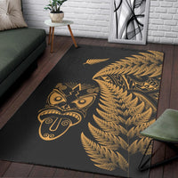 Black area rug with gold tiki face and large fern fronds motif