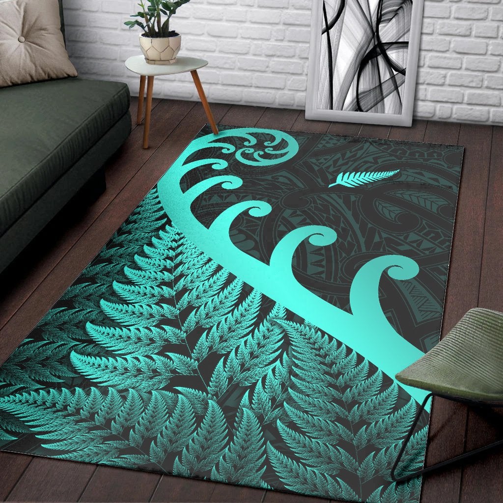 Turquoise koru swirl and fern leaf design on dark green rectangular area rug