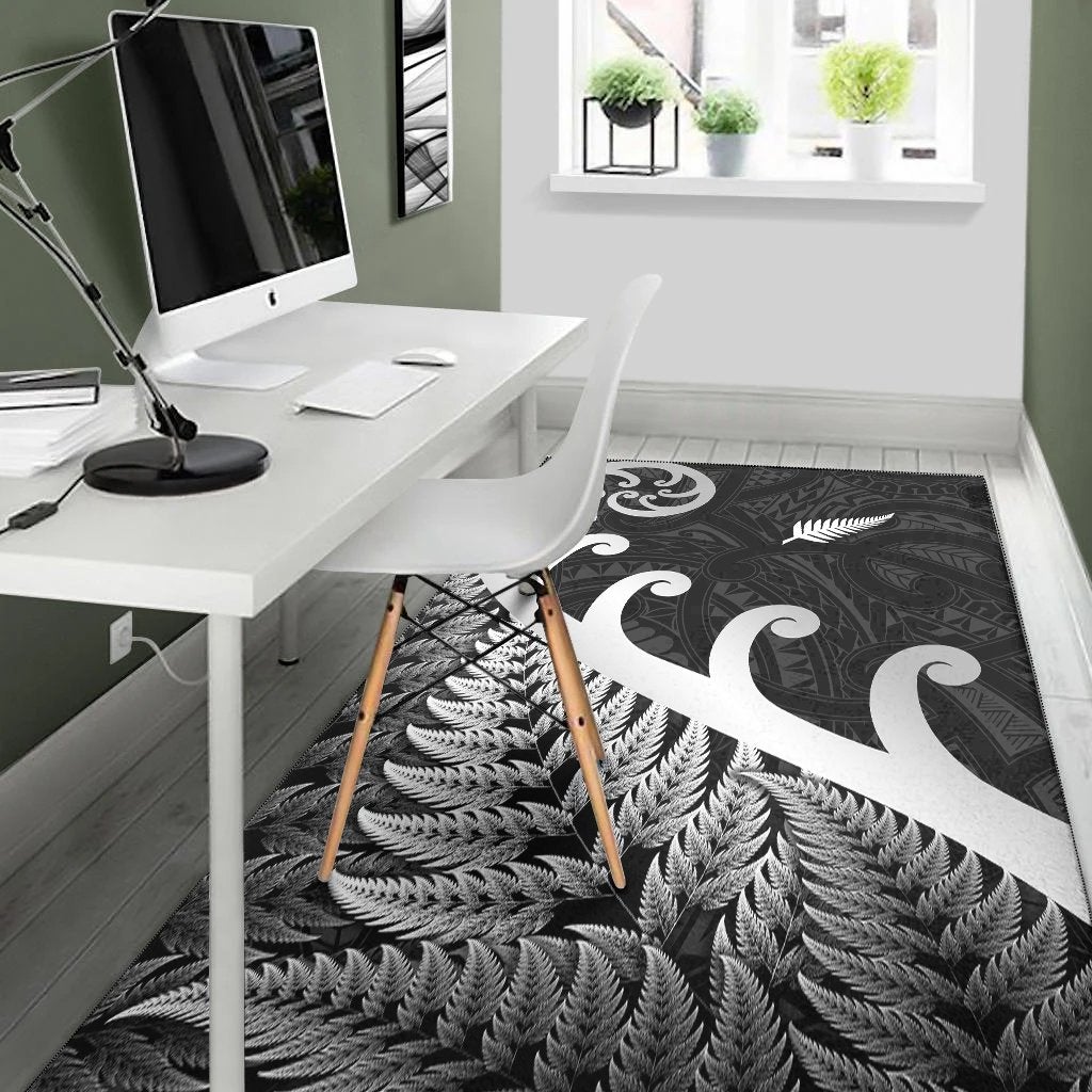 Black rug with white koru swirl and fern leaf motif, edge-to-edge pattern