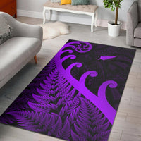 Purple and dark rug with large koru heart, fern leaves, and tribal patterns