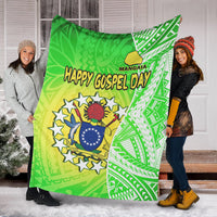 Green Polynesian coat-of-arms blanket with Happy Gospel Day headline, draped outdoors