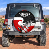 Round spare tire cover with black, red, and white Maori-style pattern and Aotearoa text