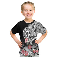 Black graphic T-shirt with tribal crest and hibiscus flowers over palm-leaf pattern