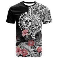 Black graphic T-shirt with tribal circle crest, hibiscus flowers, and patterned sleeves