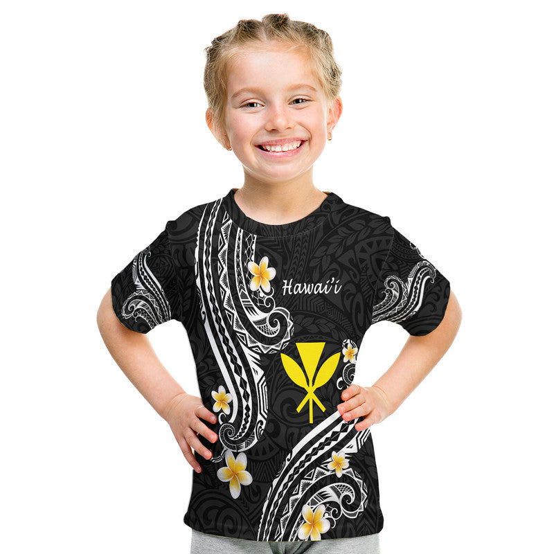 Kids black T-shirt with Polynesian-style lines, yellow emblem, and white flower graphics