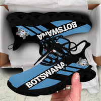 Black-sole clunky sneakers with Botswana stripe graphic and black laces