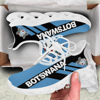 White-sole clunky sneakers with Botswana stripe graphic and black-to-blue laces