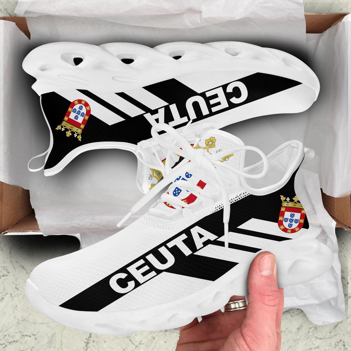 White clunky sneakers with CEUTA stripe print, thick cutout outsole, close-up side view
