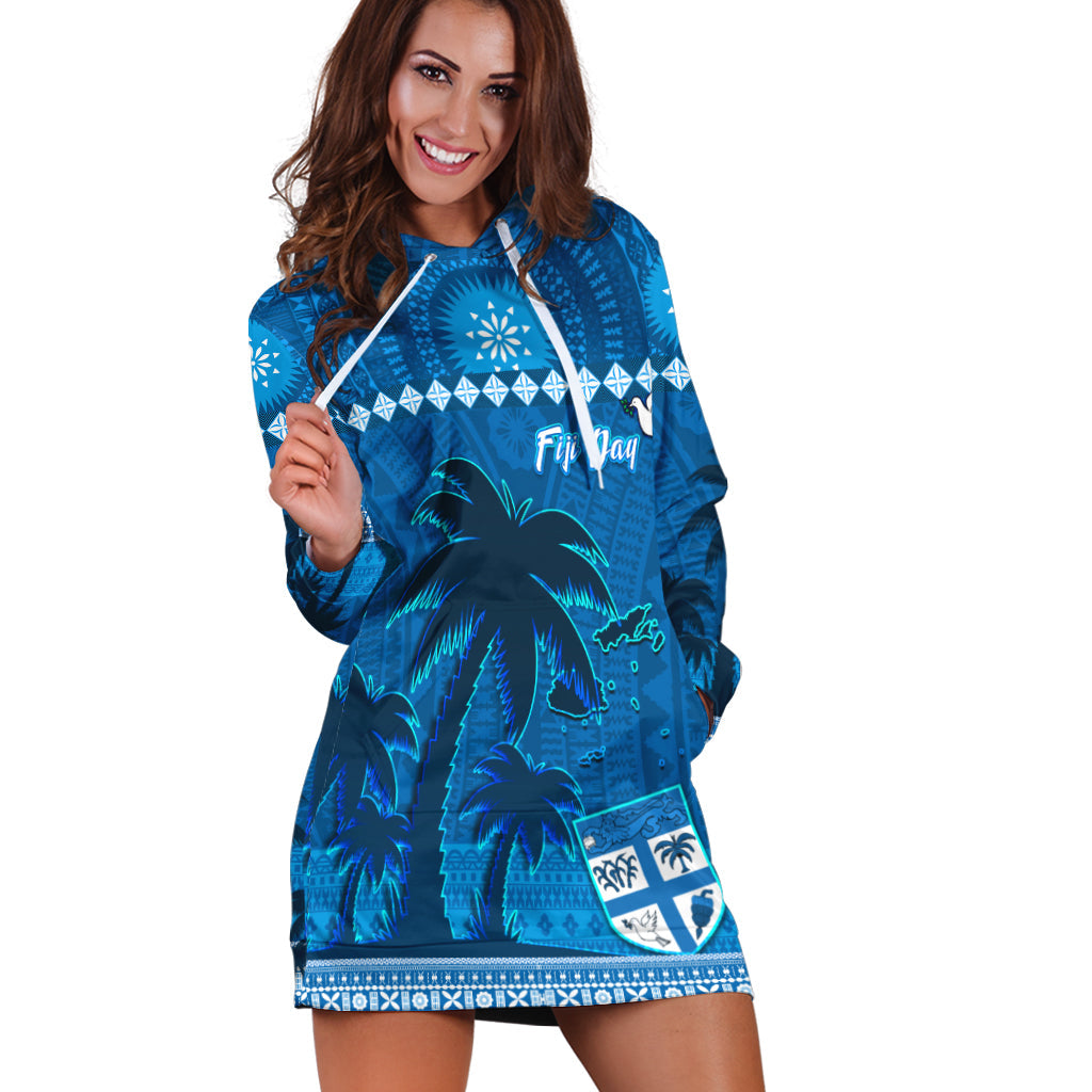 Blue hoodie dress with palm tree scene, tapa-style motifs, front pouch and hood