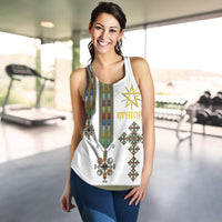 White women's racerback tank with colorful Ethiopian motif and star emblem on front