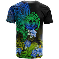 Gradient graphic T-shirt, back view with blue tribal motifs, green emblem, hibiscus flowers