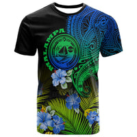Gradient graphic T-shirt with blue-green tribal emblem, hibiscus flowers, and leaf pattern
