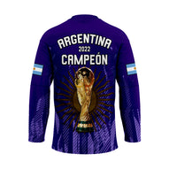 Purple Argentina hockey jersey with ARGENTINA CAMPEON 2022 text and trophy graphic