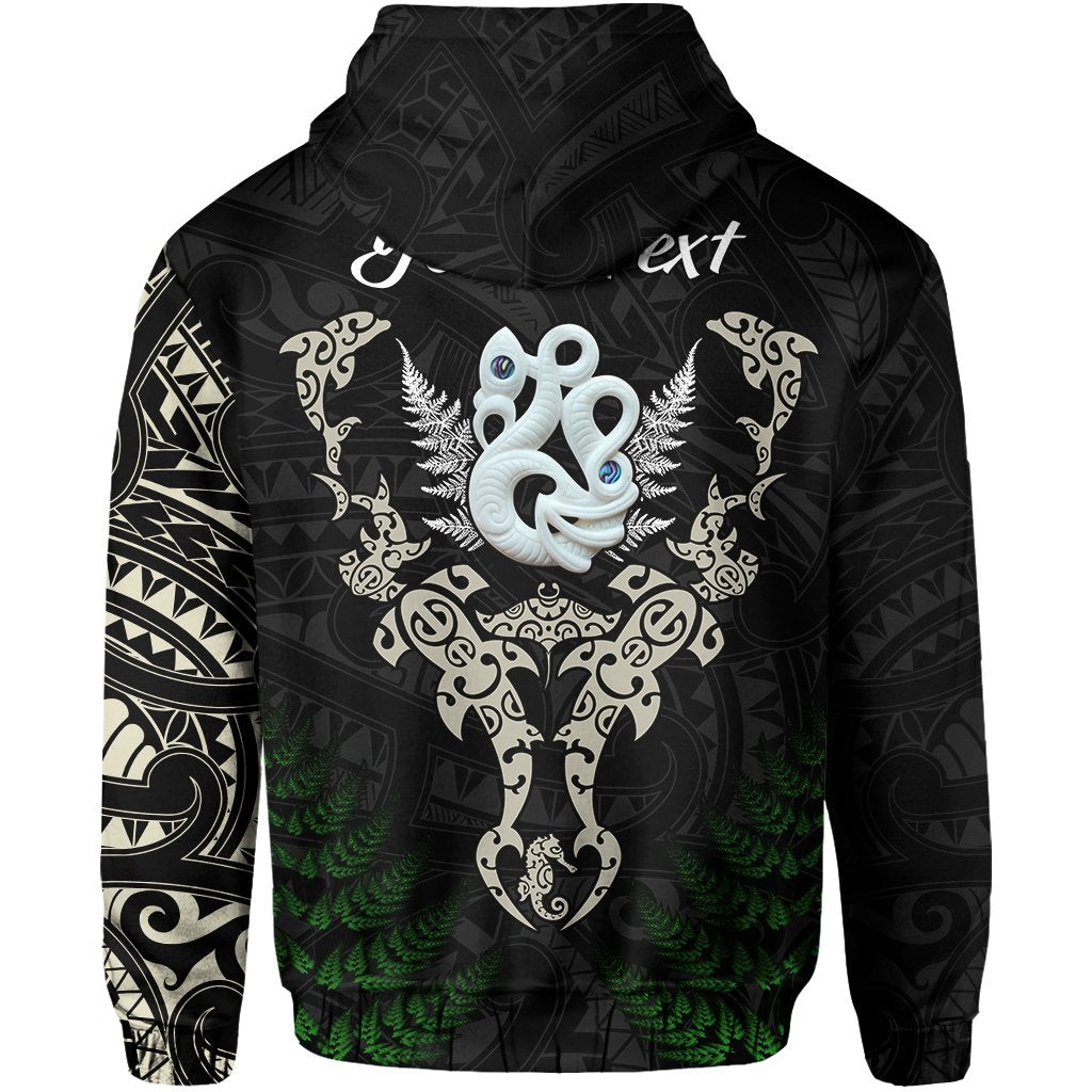 Black hoodie back with tiki face center, curling shapes, and fern motif accents
