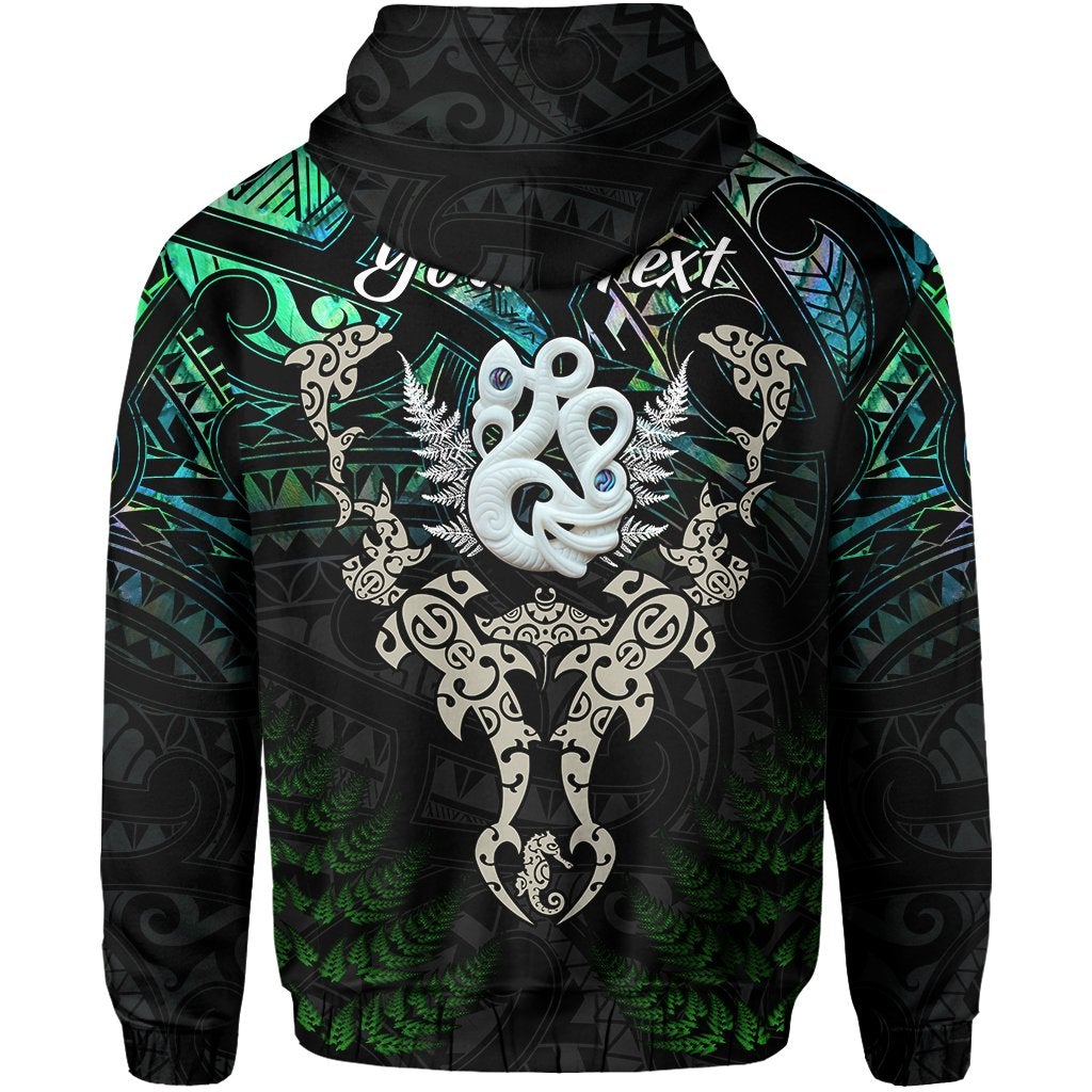 Black hoodie with green/blue Maori manaia and fish graphic, back view