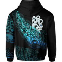 Black hoodie with teal-blue back graphic of manaia/matau fish and fern, full back