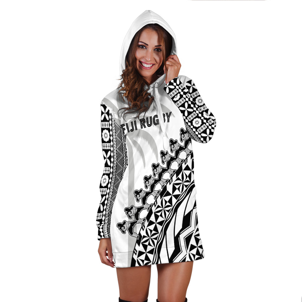 White hoodie dress with black geometric print, attached hood, long sleeves, front pocket