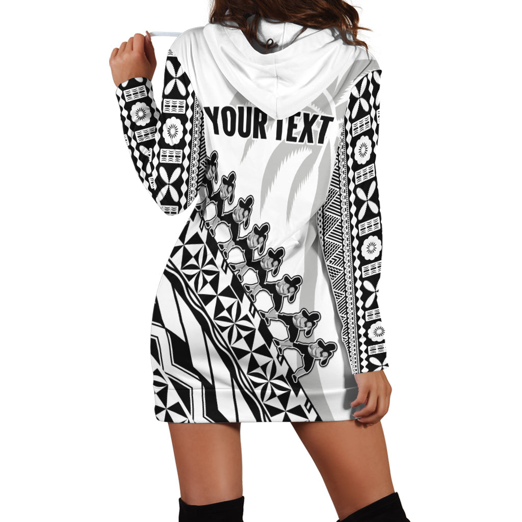 White hoodie dress with black geometric print, draped hood, long sleeves