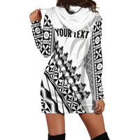White hoodie dress with black geometric print, draped hood, long sleeves