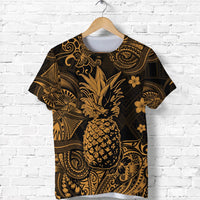 Adult T-shirt in dark fabric with gold pineapple and Polynesian tribal scroll pattern
