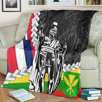 Black Polynesian blanket draped on sofa, kanaka maoli king design with flag panels