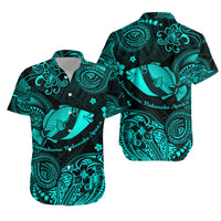 Turquoise and black short-sleeve button shirt with humuhumu fish and floral scroll pattern