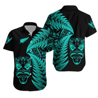 Turquoise fern and tribal face print on dark button-up Hawaiian shirt, short-sleeve