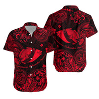 Red Polynesian fish button-up shirt with short sleeves and open collar