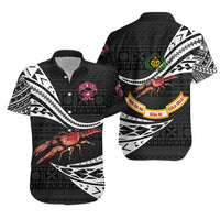 Black Hawaiian-style rugby shirt with colorful crab graphic and white tribal pattern