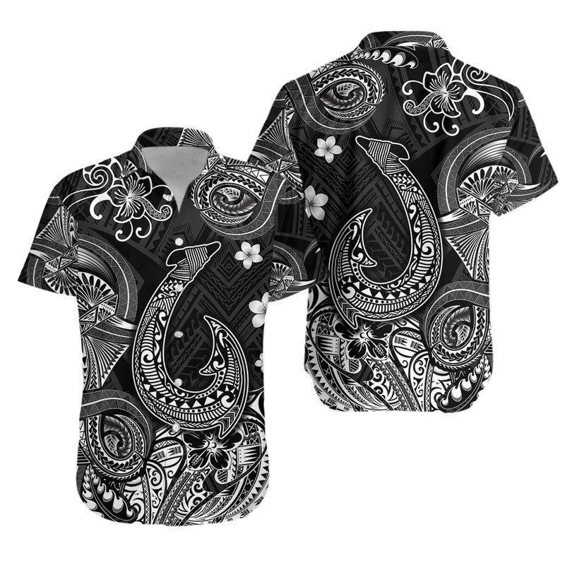 Black Hawaiian shirt with white Polynesian tribal fish and floral motifs, short sleeves