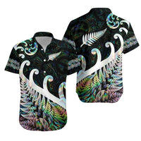 Green Hawaiian shirt with white fern/koru prints, short-sleeve button-up