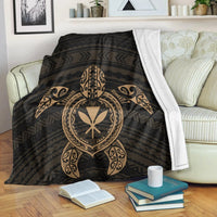 Black Hawaiian turtle patterned blanket with gold tribal mask and armband design