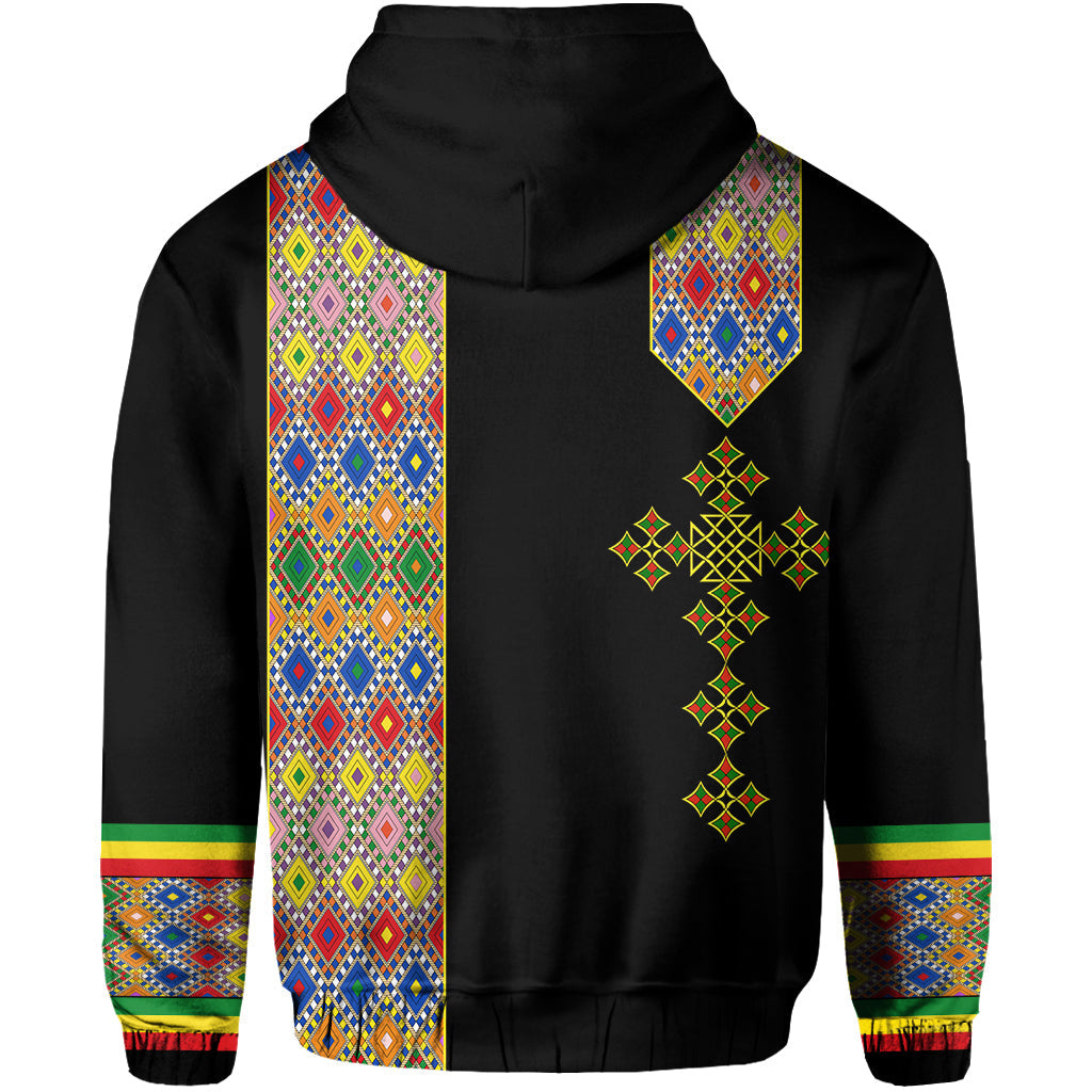 Black hoodie back with colorful patterned panels and cross-shaped emblem under hood