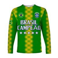 Green long sleeve football shirt with BRASIL CAMPEAO text, Brazil crest, and stars