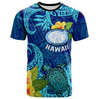 Blue short-sleeve T-shirt with Polynesian patterns, hibiscus, and Kealakehe crest