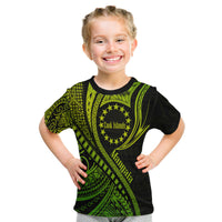 Kids green and black T-shirt with circular Cook Islands emblem and diagonal wave artwork