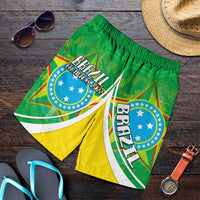 Green and yellow Brazil football shorts with Champions 2022 crest, elastic waistband