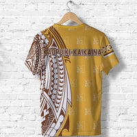 Gold tribal print T-shirt with Kaopuiki-Kaikaina text and geometric sleeve