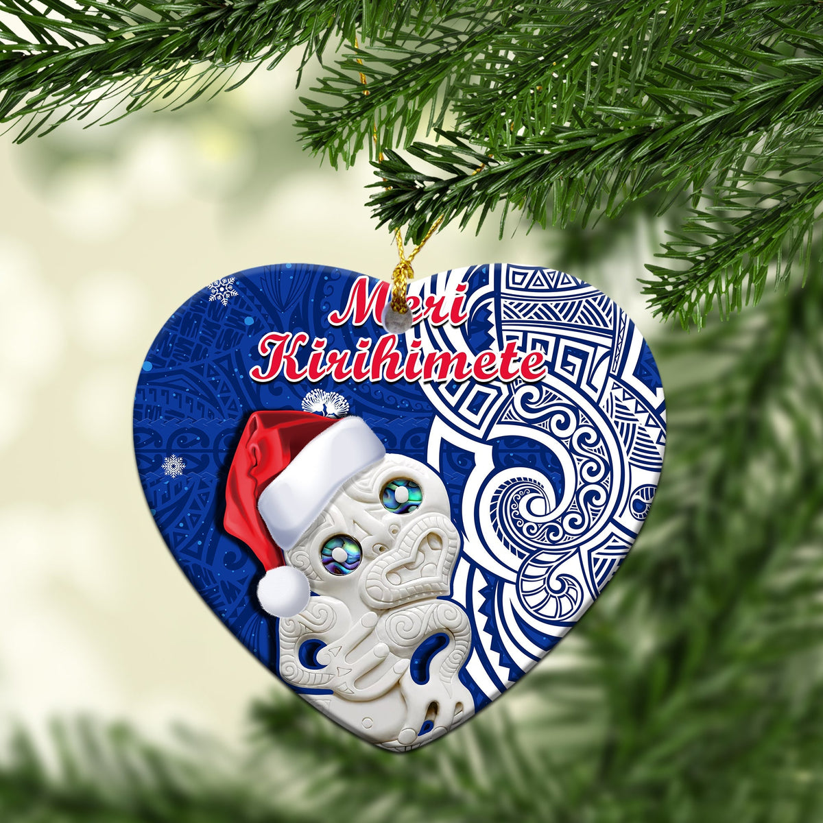 Blue circle ceramic Christmas ornament with Hei Tiki and “Meri Kirihimete” text