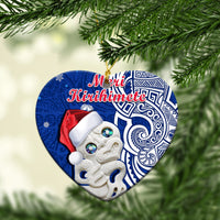 Blue circle ceramic Christmas ornament with Hei Tiki and “Meri Kirihimete” text