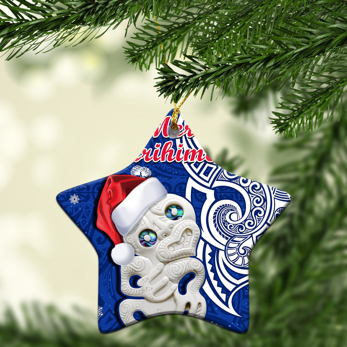 Blue star-shaped ceramic Christmas ornament with Hei Tiki and “Meri Kirihimete” text