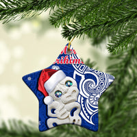 Blue star-shaped ceramic Christmas ornament with Hei Tiki and “Meri Kirihimete” text