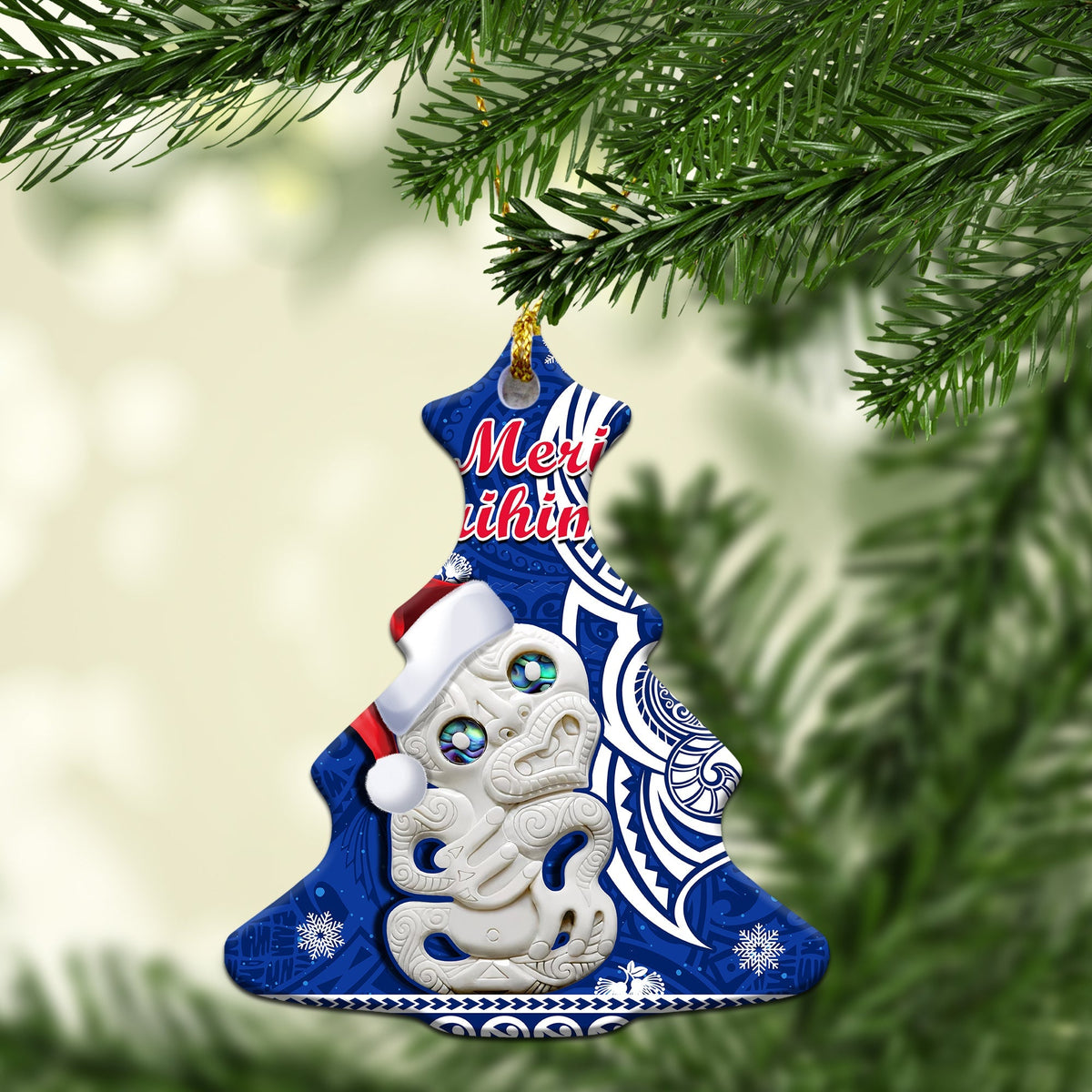 Blue Christmas tree-shaped ceramic ornament with Hei Tiki and “Meri Kirihimete” text