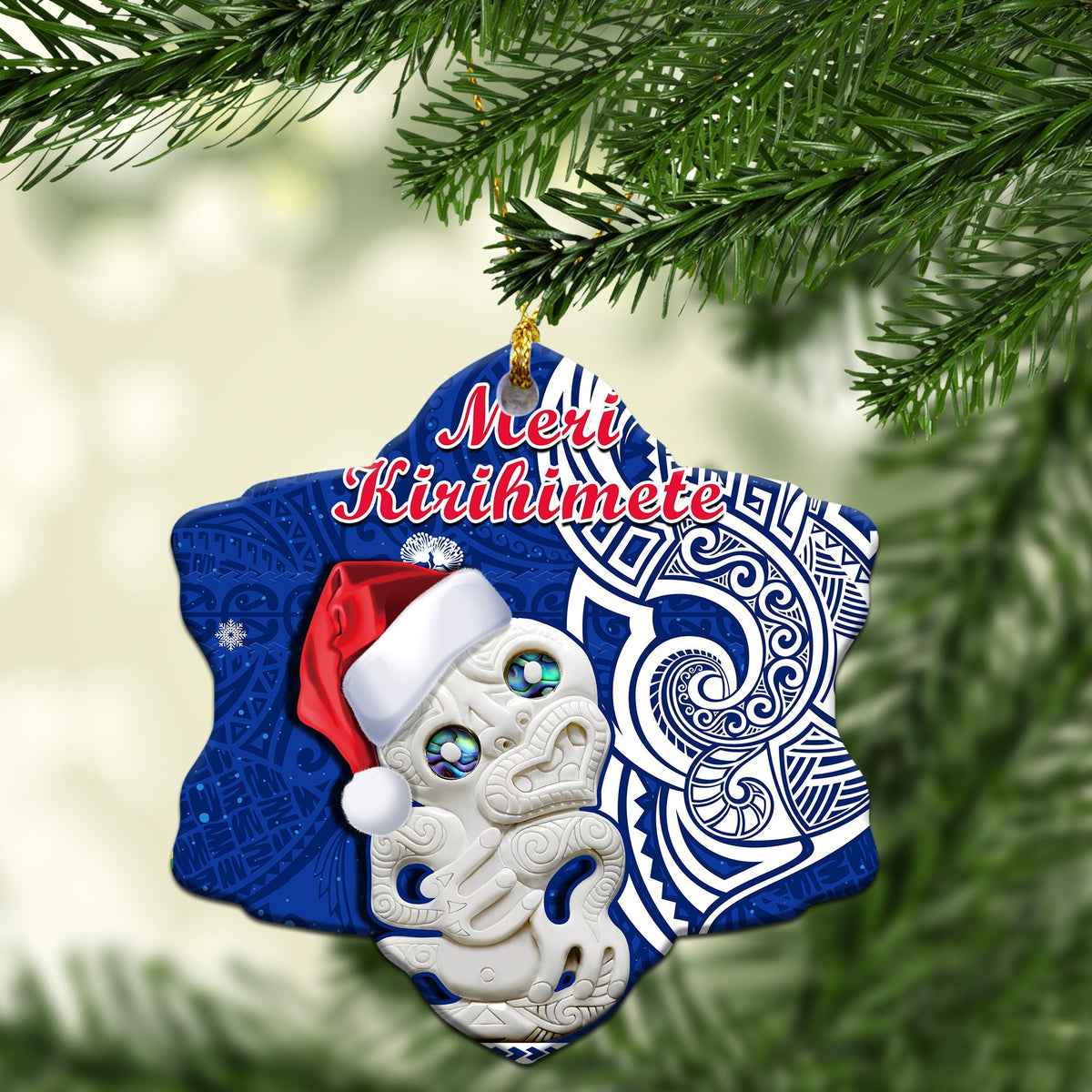 Blue heart-shaped ceramic Christmas ornament with Hei Tiki and “Meri Kirihimete” text