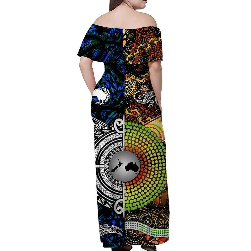 Blue off-shoulder maxi dress back view with circular motif and black/white swirl design