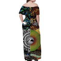 Off-shoulder maxi dress back view, black with green, orange, and white tribal graphics