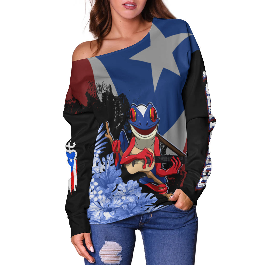 Off-shoulder sweater with long sleeves, dark base and colorful coqui frog front graphic